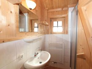 a bathroom with a sink and a mirror at Holiday Home Schwendau-2 by Interhome in Hippach