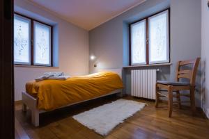 La Marmote Albergo Diffuso di Paluzza Cleve房間的床