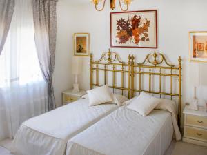 A bed or beds in a room at Holiday Home Papagayo by Interhome