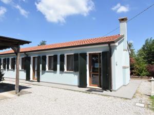 a small white building with a red roof at Holiday Home Azienda Agricola Forzello-1 by Interhome in San Basilio