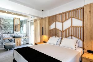 Posteľ alebo postele v izbe v ubytovaní White Rock Villas Nikiana