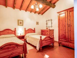 A bed or beds in a room at Holiday Home Il Casellino-2 by Interhome