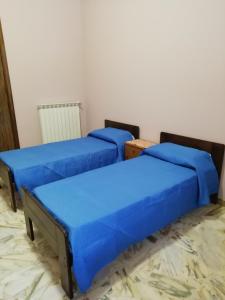 Posteľ alebo postele v izbe v ubytovaní Casa Ai Cappuccini