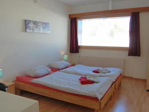 a bedroom with two beds and a window at Apartment Rosablanche A24 by Interhome in Siviez