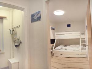 เตียงในห้องที่ Apartment Promenade - Utoring-11 by Interhome