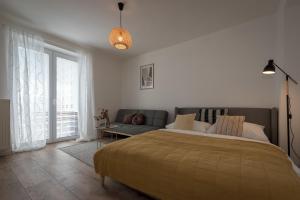 מיטה או מיטות בחדר ב-Symple apartments