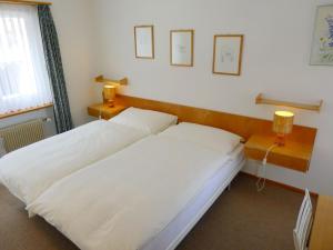 En eller flere senge i et værelse på Apartment Promenade - Utoring-74 by Interhome