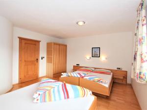 Posteľ alebo postele v izbe v ubytovaní Apartment Hansjörg-5 by Interhome