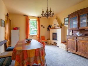 a kitchen with a table and a dining room at Holiday Home Casa della Peschiera by Interhome in Isola d'Asti