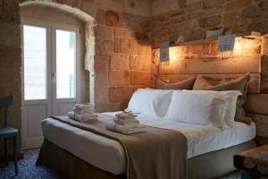 Postel nebo postele na pokoji v ubytování Dei Serafini