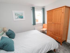 Säng eller sängar i ett rum på Sea View Lodge
