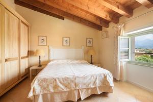 A bed or beds in a room at Residence Villa Antica Torre