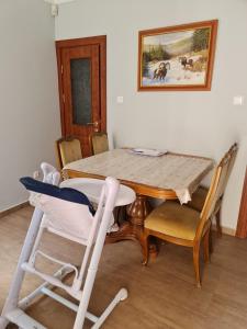 a dining room with a table and some chairs at My-Lord LuxApartman in Eger +48 photos