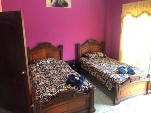 Postel nebo postele na pokoji v ubytování La Casa de Jeimy