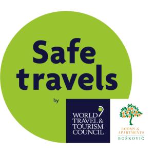 a green circle with the words safe travels on it at Rooms & Apartments Boskovic in Budva
