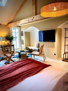 a bedroom with a loft bed and a living room at Villa Louisa in Saint Malo