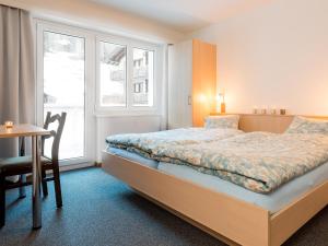 En eller flere senge i et værelse på Apartment Amici-1 by Interhome