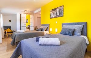 Una cama o camas en una habitación de Villa Rampini - 300m2 Istria house with a pool, playground, grill, garden & private parking