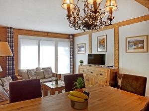 a dining room with a table with bananas on it at Apartment Sulegg by Interhome in Wengen
