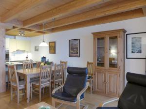 a kitchen and dining room with a table and chairs at Apartment Racer's Retreat-1 by Interhome in Wengen