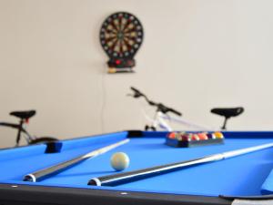 a pool table with a ball in a room at Holiday Home Villa Mustra by Interhome in Okrug Donji