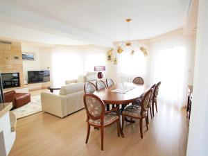 a living room with a dining room table and chairs at Holiday Home Villa Mustra by Interhome in Okrug Donji