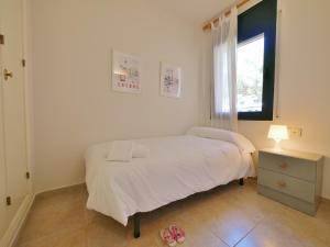 Postel nebo postele na pokoji v ubytování Apartamento con piscina en LLAFRANC
