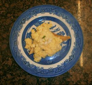 a blue and white plate of food on a table at Rathmore House Bed & Breakfast in Baltimore