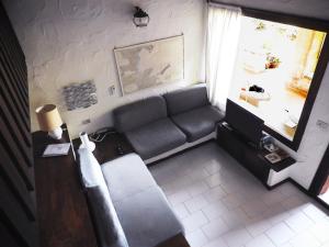 Posezení v ubytování Casa Costa Corallina Mare