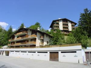 a large apartment building on top of a hill at Apartment Tourbillon A 27 by Interhome in Ovronnaz