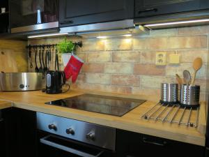 a kitchen with a counter top with a sink at Chalet Lazny by Interhome in Pohorsko