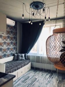 a room with a bed and a window at Мила апартаменты в центре Новосибирска in Novosibirsk