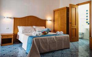 Posteľ alebo postele v izbe v ubytovaní Hotel Rojas