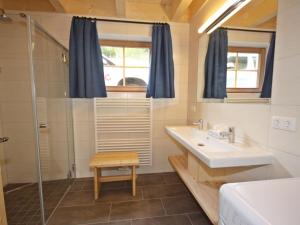 A bathroom at Chalet Glockner by Interhome