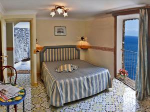 Кровать или кровати в номере La Locanda Del Fiordo