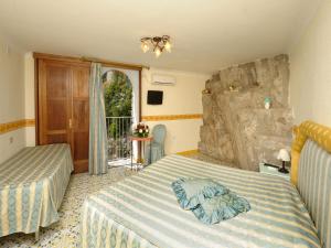 Кровать или кровати в номере La Locanda Del Fiordo