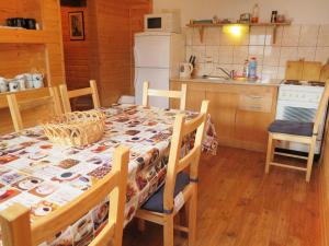 a kitchen with a table with a table cloth on it at Holiday Home Lenora I by Interhome in Lenora