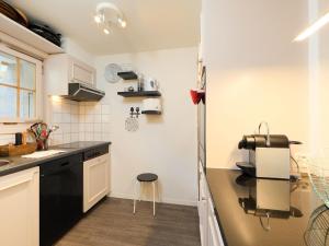 a kitchen with a sink and a counter top at Apartment Cristel 2 by Interhome in Villars-sur-Ollon