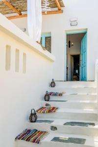 a staircase in a house with white walls at Ilias Apartments in Platanias