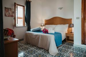 Posteľ alebo postele v izbe v ubytovaní Hotel Rojas