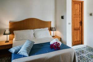 Posteľ alebo postele v izbe v ubytovaní Hotel Rojas
