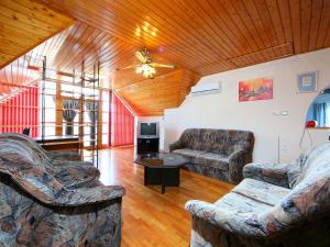 a living room with two couches and a table at Apartment Cabernet by Interhome in Balatonszemes