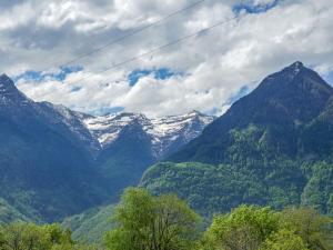 a view of a mountain range with snow covered mountains at Holiday Home Rustico 1787 by Interhome in Bodio