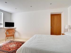 Uma cama ou camas num quarto em Holiday Home Winker by Interhome