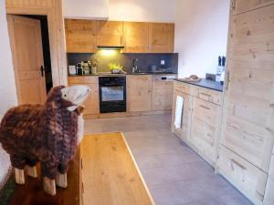 a kitchen with a stuffed animal standing on a table at Apartment Regina B9 by Interhome in Villars-sur-Ollon