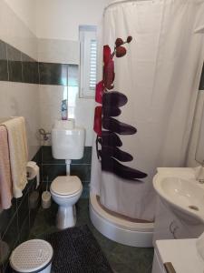 Kylpyhuone majoituspaikassa Apartment Valeria