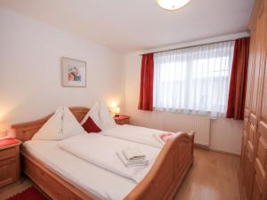 A bed or beds in a room at Apartment Schloßmühle by Interhome