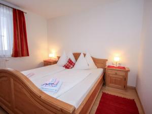 A bed or beds in a room at Apartment Schloßmühle by Interhome