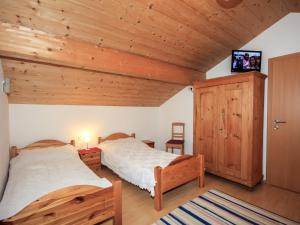 A bed or beds in a room at Apartment Schloßmühle by Interhome