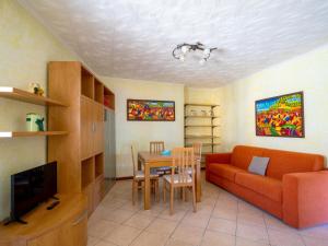 a living room with a couch and a table at Holiday Home La mia Casetta by Interhome in Porto Valtravaglia